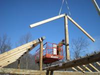 The crane lowers the rafters as the Great Northern Barns crew checks the placement for this frame in Westchester County, NY. 